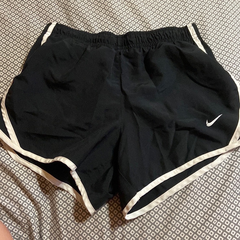 1 Nike shorts and 1 under armor shorts